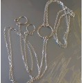 O-ring choker with chains and nipple rings. Sterling silver