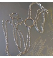 O-ring choker with chains and nipple rings. Sterling silver