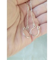 O-ring choker with chains and nipple rings. Sterling silver