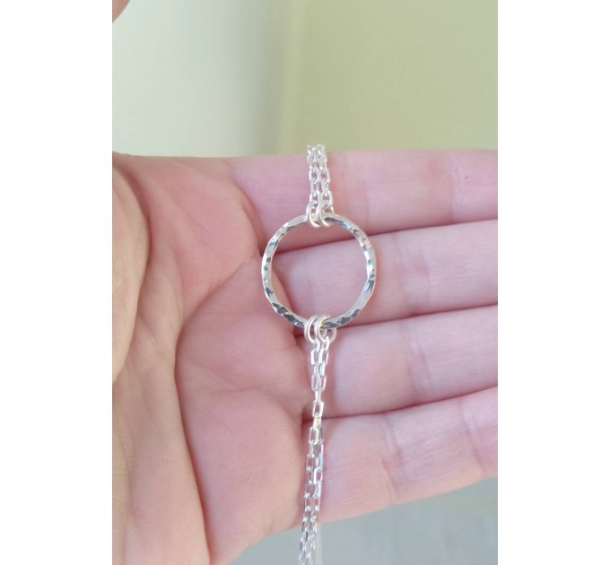 O-ring choker with chains and nipple rings. Sterling silver