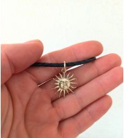 Sun choker with black leather cord. Handmade in silver or
brass