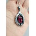 Silver yoni pendant with ruby