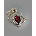 Silver yoni pendant with ruby