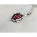 Silver yoni pendant with ruby